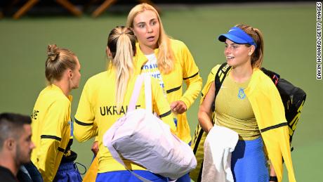 Katarina Zavatska talks with her team following her loss to American Jessica Pegula in the first round of the 2022 Billie Jean King Cup qualifier.