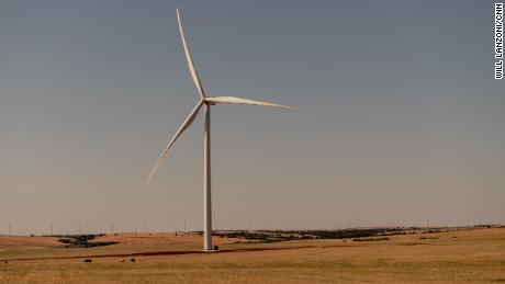 The morning sun illuminates a turbine near Weatherford.