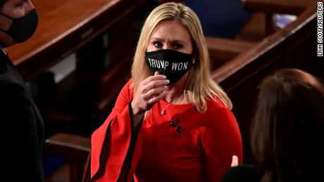 Rep. Marjorie Taylor Greene (R-GA) wears a &quot;Trump Won&quot; face mask as she arrives on the floor of the House to take her oath of office as a newly elected member of the 117th House of Representatives in Washington, U.S., January 3, 2021.  