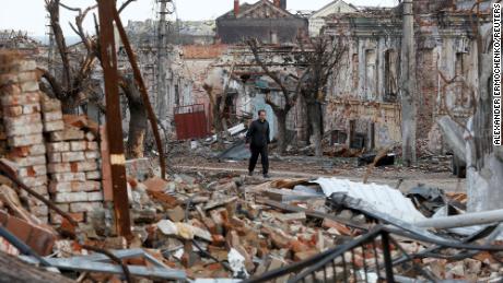 A man walks among the debris of the damaged southern port city of Mariupol, on April 22.