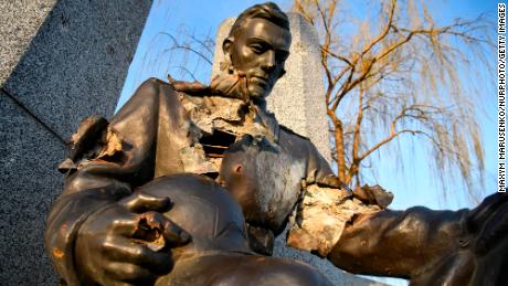 Monument to Second World War Soviet soldiers, damaged by shelling, in the Kyiv area, April 6. 