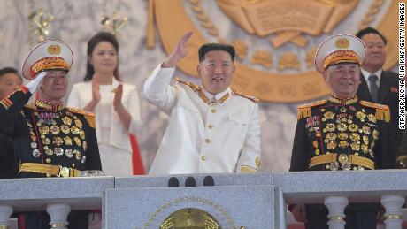 This picture taken on Monday and released from North Korea&#39;s official Korean Central News Agency on Tuesday shows North Korean leader Kim Jong Un, center, attending a grand military parade in Pyongyang.