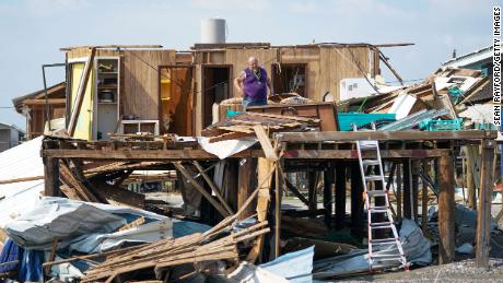 A Grand Isle, Louisiana, resident looks through his home after category 4 Hurricane Ida made landfall in August 2021.