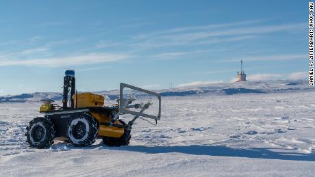 The ECHO rover is shown in front of the Single Penguin Observation &amp; Tracking observatory.