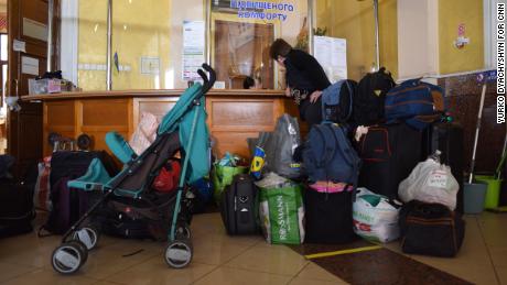 Baby strollers, diapers and formula line the entryway of the room for women and children above Lviv station.