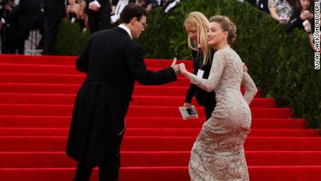 Johnny Depp and Amber Heard, then engaged, arrive at the Met Gala in 2014.