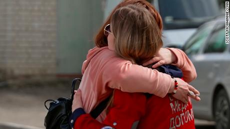 Rudkovskaya hugs her mother at the start of her 24-hour shift. 