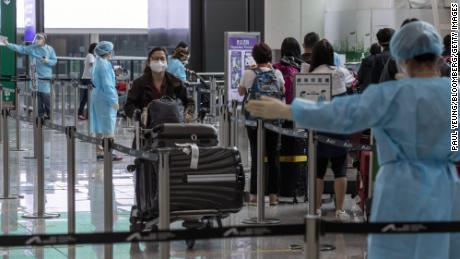 Travelers heading to quarantine at the Hong Kong International Airport on April 1.