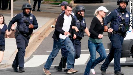 Police evacuate people near the scene of the shooting in northwest Washington.