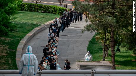 Office workers wait in line for a Covid test in Beijing on April 28.