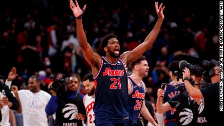 Joel Embiid celebrates his game-winning shot.