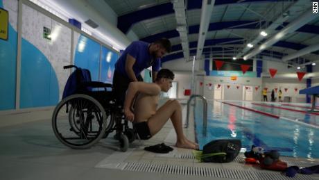 Ilia Sharkov (right) trains with his swimming coach, Ilya Kalashnik (left), at a public pool in Istanbul, Turkey. 