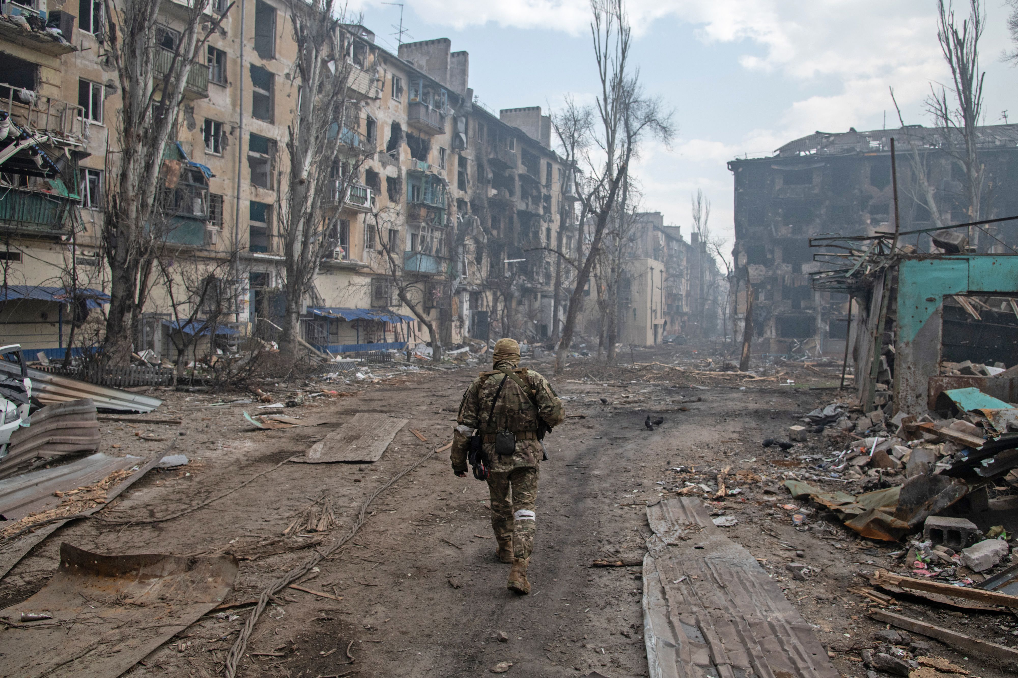 A Russian soldier walks amidst the rubble in Mariupol's eastern side on April 15.