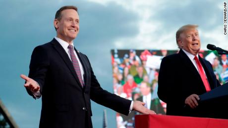 Rep. Ted Budd, left, reacts as he takes the stage with Trump in North Carolina. 