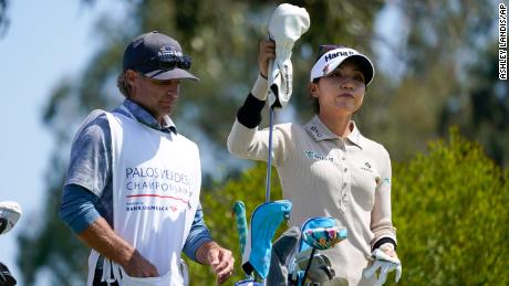 Ko chooses a club at the fourth tee during the final round of the Palos Verdes Championship.