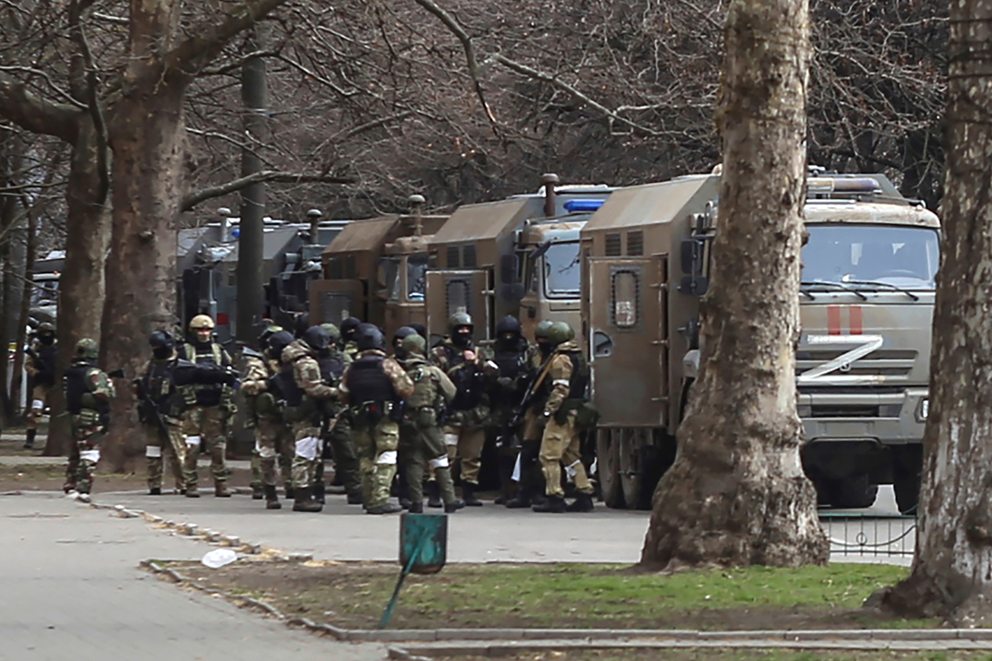 Russian soldiers stand near trucks in Kherson, Ukraine on March 7. 