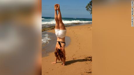 Carefree times ... Cline showcases her gymnastic talent on the beach.