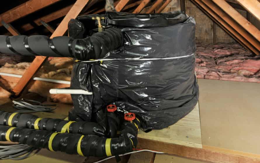 Domestic dwelling loft roof space with lagging to pipes and cold water storage tank to reduce risk of freezing and burst pipes.