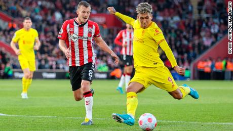 Southampton&#39;s James Ward-Prowse closes down Roberto Firminho.