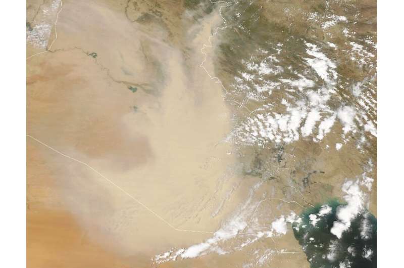 A satellite image provided by NASA Earth Observatory taken on May 5, 2022, shows a dust storm engulfing parts of Iraq and neighb