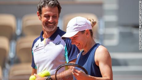 Simona Halep shares a light hearted moments with coach Patrick Mouratoglou during preparation for Roland Garros on May 18, 2022 in Paris, France. 