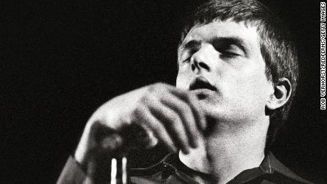 Joy Division frontman Ian Curtis performing onstage before his death in 1980.