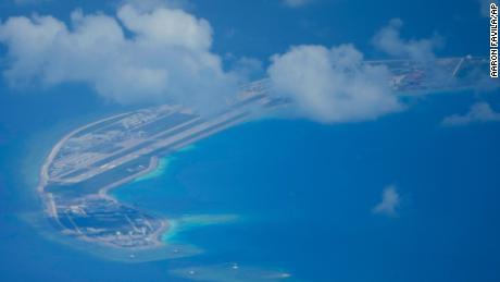 A Chinese air strip is clearly visible beside structures and buildings on the contested Mischief Reef in the Spratly group of islands in the South China Sea, March 20, 2022. 