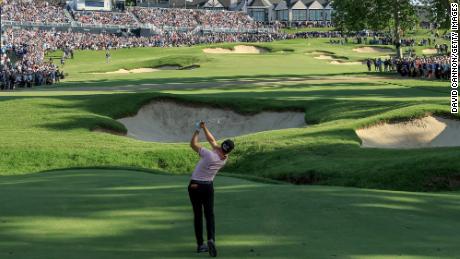 Thomas prepares to play his second shot on the 18th hole of the sudden-death play-off.