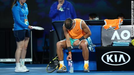 Rafael Nadal  adjusts a water bottle during his quarterfinal match against Frances Tiafoe of the United States at the 2019 Australian Open in Melbourne.