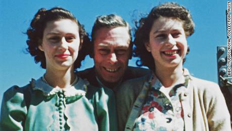 King George VI poses with his daughters, Princess Elizabeth and  Princess Margaret, in 1947.