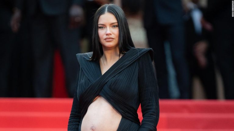 Adriana Lima shows off baby bump on Cannes red carpet