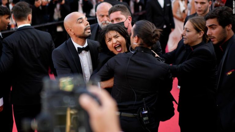 Woman storms Cannes red carpet denouncing sexual violence in Ukraine