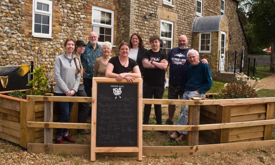 Villagers and volunteers prepare for the opening of the saved Blue Bell pub in Stoke Ferry, Norfolk.