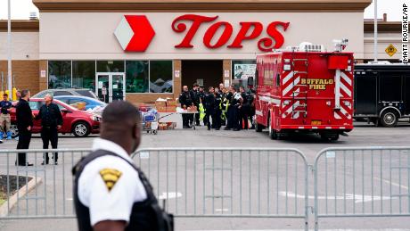 Investigators work the scene of a shooting at a supermarket in Buffalo on Monday, May 16, 2022. 