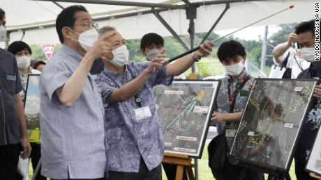 Japanese Prime Minister Fumio Kishida, left, visits the US military&#39;s Camp Foster in Okinawa on May 15, 2022, the 50th anniversary of the southern island prefecture&#39;s reversion to Japan from US rule.