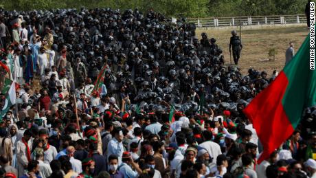 Police attempt to quell protests by supporters of the Pakistan Tehreek-e-Insaf (PTI) political party during a demonstration called by former Prime Minister Imran Khan, in Islamabad on May 26, 2022. 