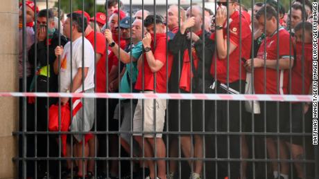 Liverpool fans are seen queuing outside the stadium prior to the UEFA Champions League final.