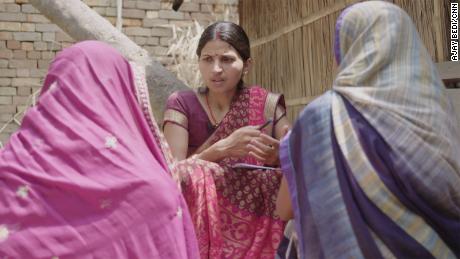 Local mental health counselor Swetanjali Jha talks to former patient Mamta Kumari and her sister-in-law, Anjali.