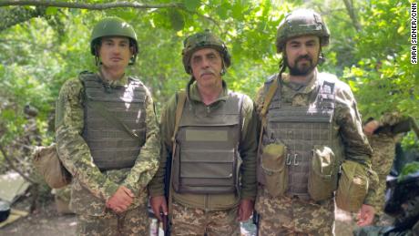 Yaroslav, center, signed up to fight alongside his sons -- Pavlo, left, and Nazar.