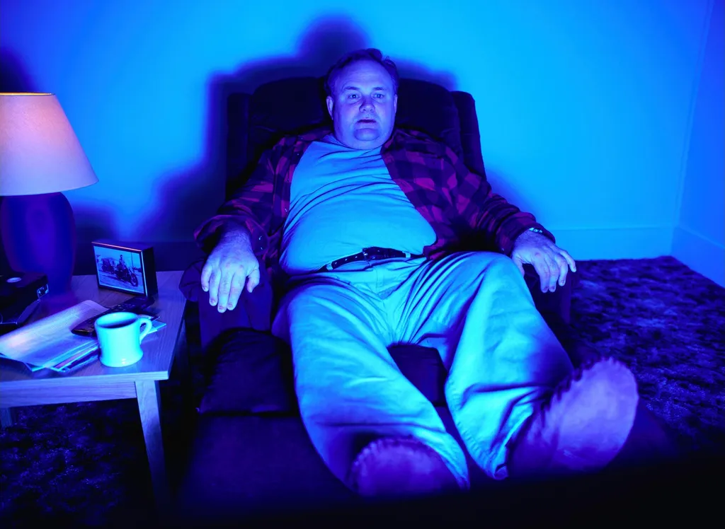 Man Recliner Watching Television