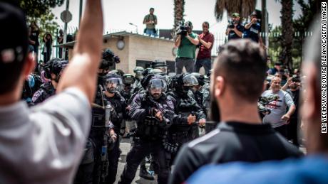 Israeli border police pictured during the funeral on Friday.