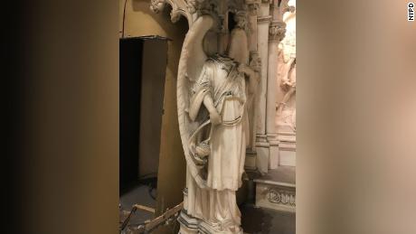 A head was removed from an angel statue flanking the alter during the theft, officials said.