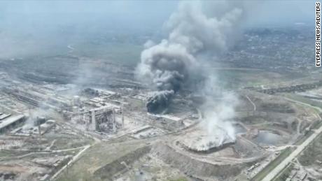 A drone image released by the Mariupol City Council on Monday, April 18, shows a large plume of smoke rising from the Azovstal steel plant.