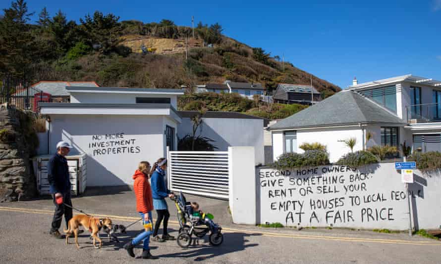 Graffiti painted on to the walls of a property in St Agnes, Cornwall, protests against second-home ownership in the county.