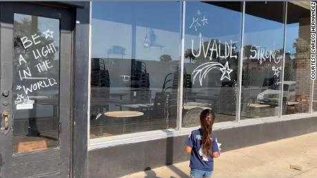 &quot;Uvalde Strong&quot; and other uplifting messages are written on the windows of Carlitos Way.