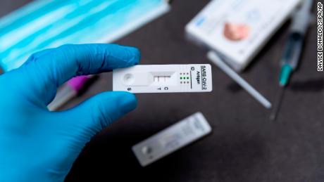 A rapid Covid test, also known as antigen test or lateral flow test, shows a positive result in a close up on a table in Barcelona, Spain on February 04.