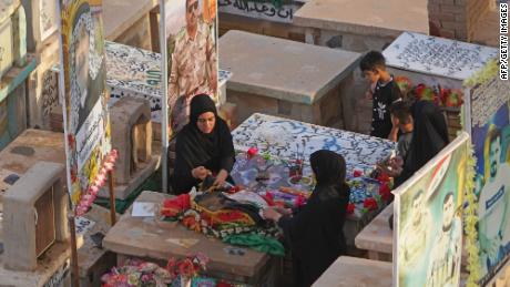 Muslims visit the graves of their relatives on May 3 at the Wadi al-Salam (Valley of Peace) cemetery in Iraq&#39;s holy city of Najaf during Eid al-Fitr holiday, which marks the end of the holy fasting month of Ramadan.