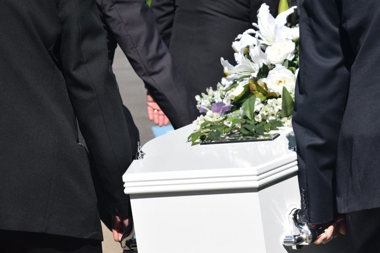 Few eligible families have applied for government help to pay for COVID funerals