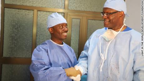 Dr. Preston Phillips, right, shakes hands with Dr. Komi Folly during a medical mission in Togo in 2019.