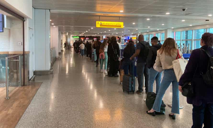 Passengers queue for flights at Heathrow airport.